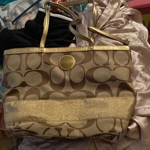 Gold hand crafted coach bag